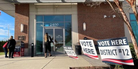 a group of people outside a building