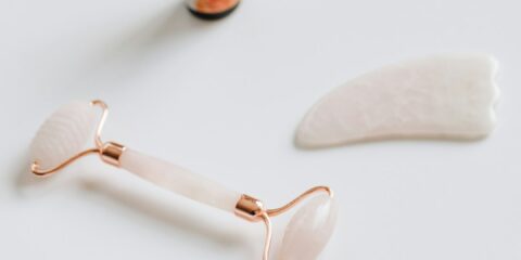 white and black glass bottle beside white heart shaped ornament