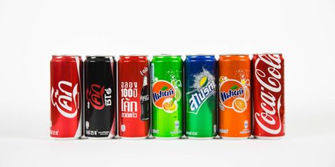 seven assorted-brand soda cans