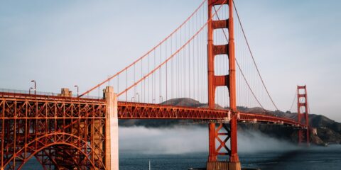 The golden gate bridge is surrounded by fog