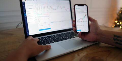 macbook pro on brown wooden table