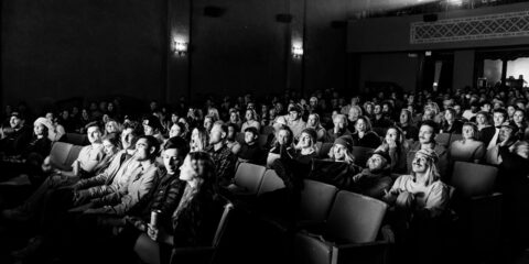 a black and white photo of a crowd of people