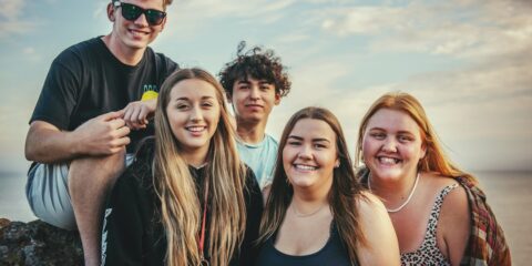 photography of five people near outdoor during daytime