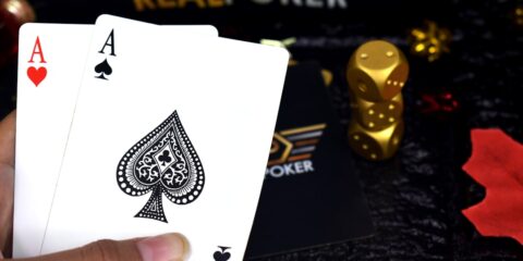 two ace of spade and ace of heart playing cards