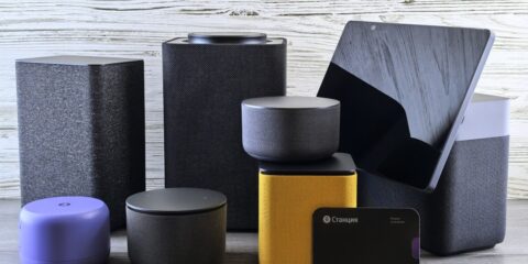 Collection of modern electronic devices and speakers.