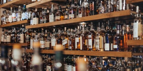 assorted-color bottle lot on shelf