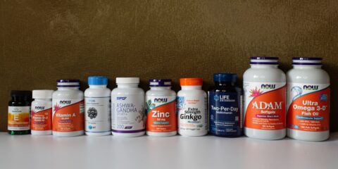 a row of bottles of different types of vitamins