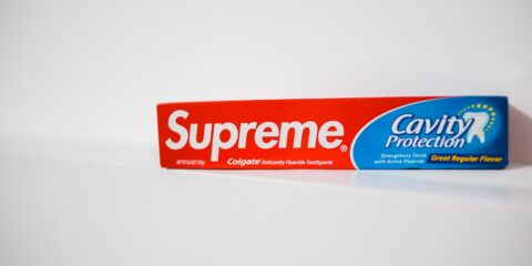 colgate toothpaste box on white surface
