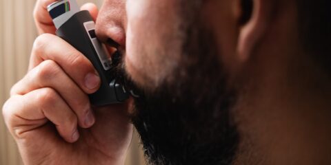 A man holding a cell phone to his ear