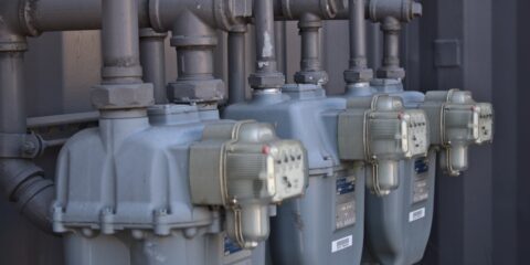 a row of water pumps sitting next to each other