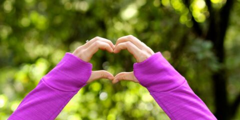 human hand forming hand during daytime