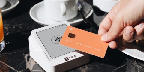 Virtual Interview – Payments (Nationwide) – Earn $350 A person holding a credit card over a table