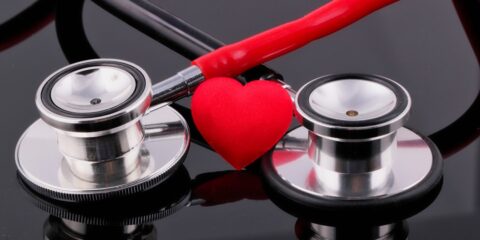 a stethoscope and a heart on a table