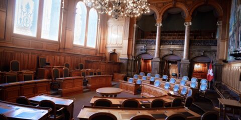 a large room with chairs and a chandelier