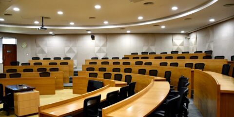A room filled with lots of wooden desks